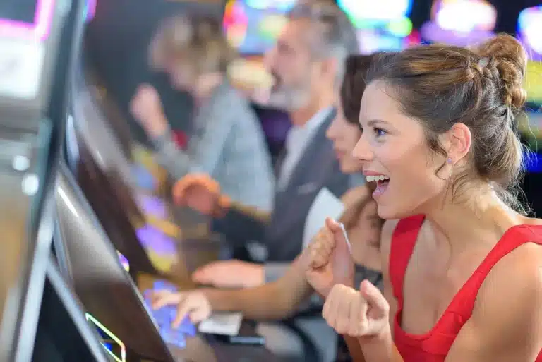 Women and guy excited playing the slots